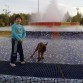 Daniel, mí hijo con su perro Charly en la fuente.